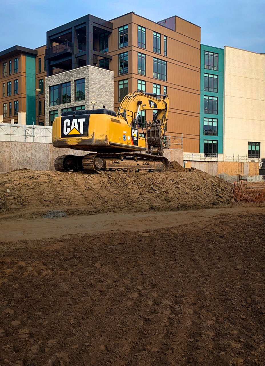 A CAT hydraulic excavator from East Coast Civil Group, at an excavation job site near Raleigh, NC.